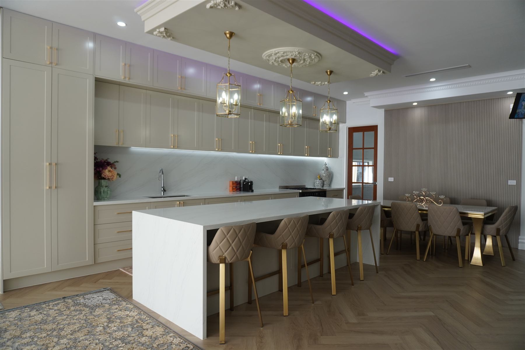 Cream kitchen and dining area with marble benchtops